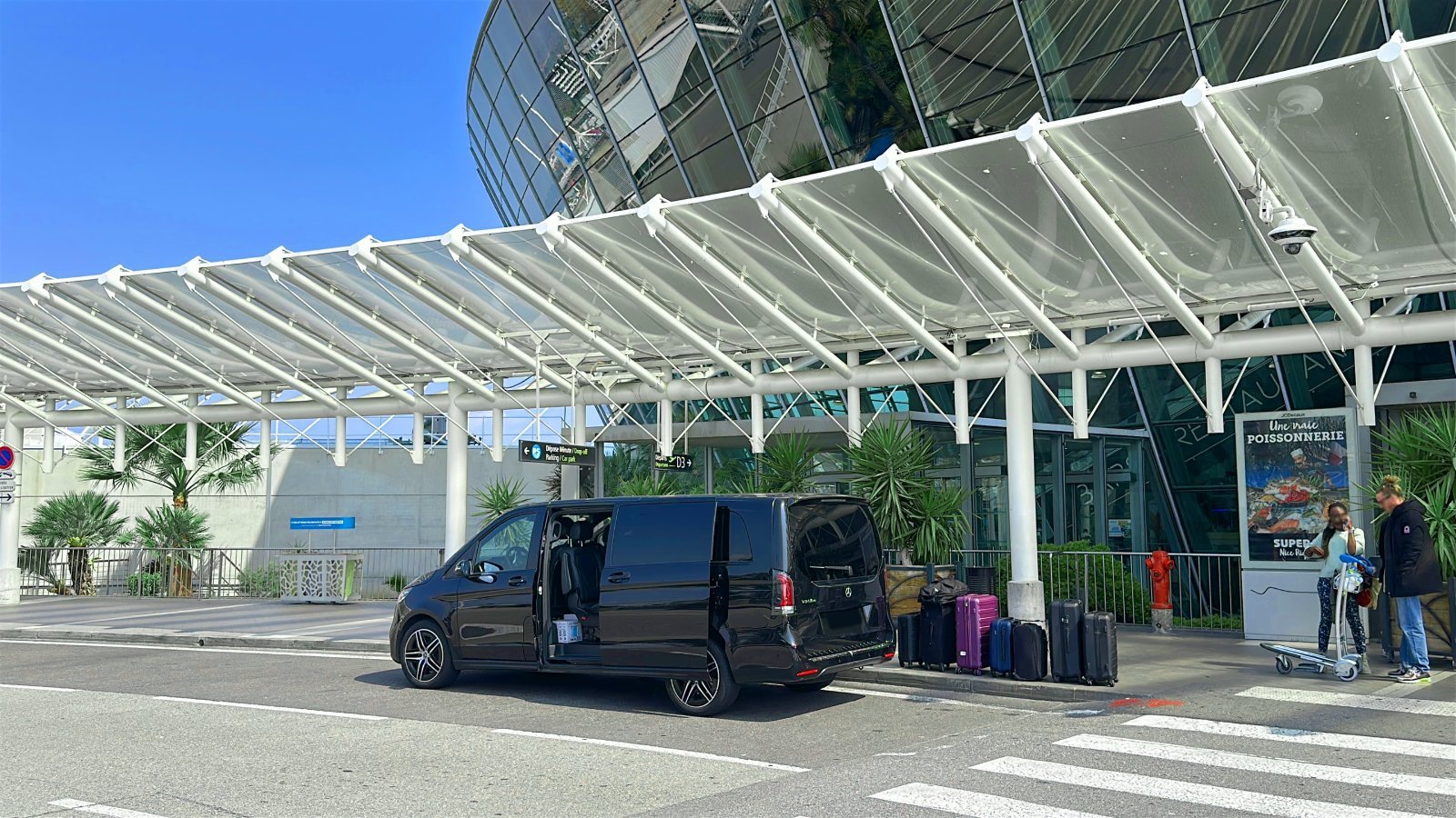 Passengers boarding a private airport transfer vehicle in Europe with ByCar