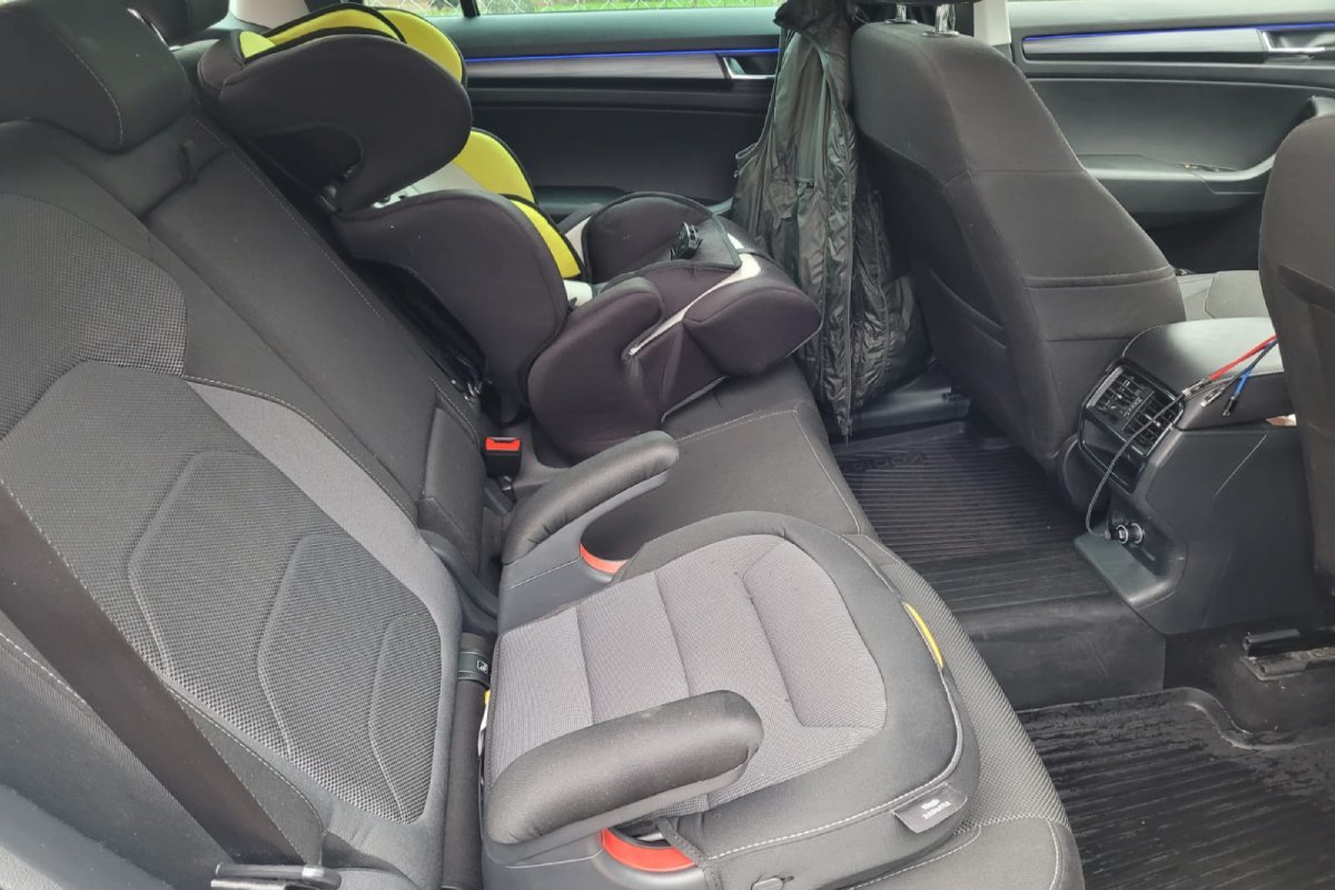Child seat and booster seat installed on the rear seat of a transfer vehicle