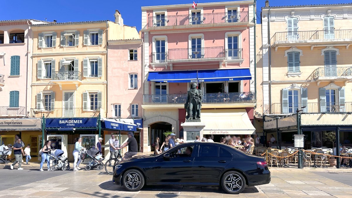 Driver waiting in a car outside a Saint-Tropez hotel