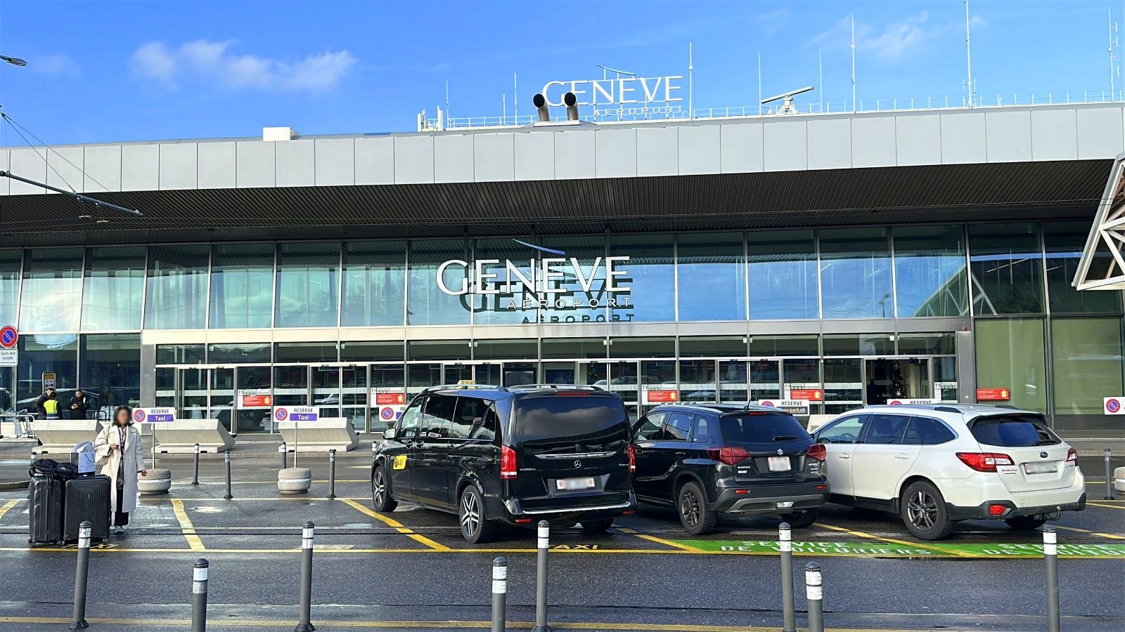 Geneva Airport exterior with passenger waiting for a transfer to Courchevel