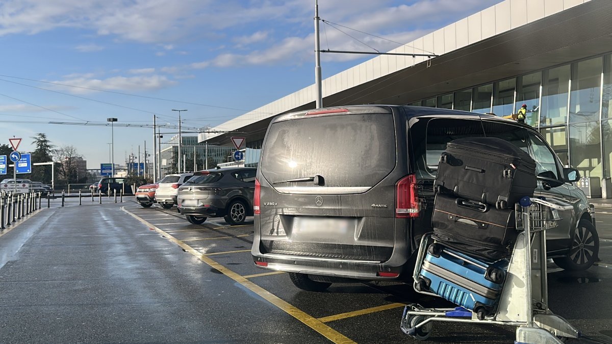 Suitcases brought on a trolley at Geneva Airport to be loaded into the Mercedes V-Class luggage compartment for the subsequent transfer to Morges