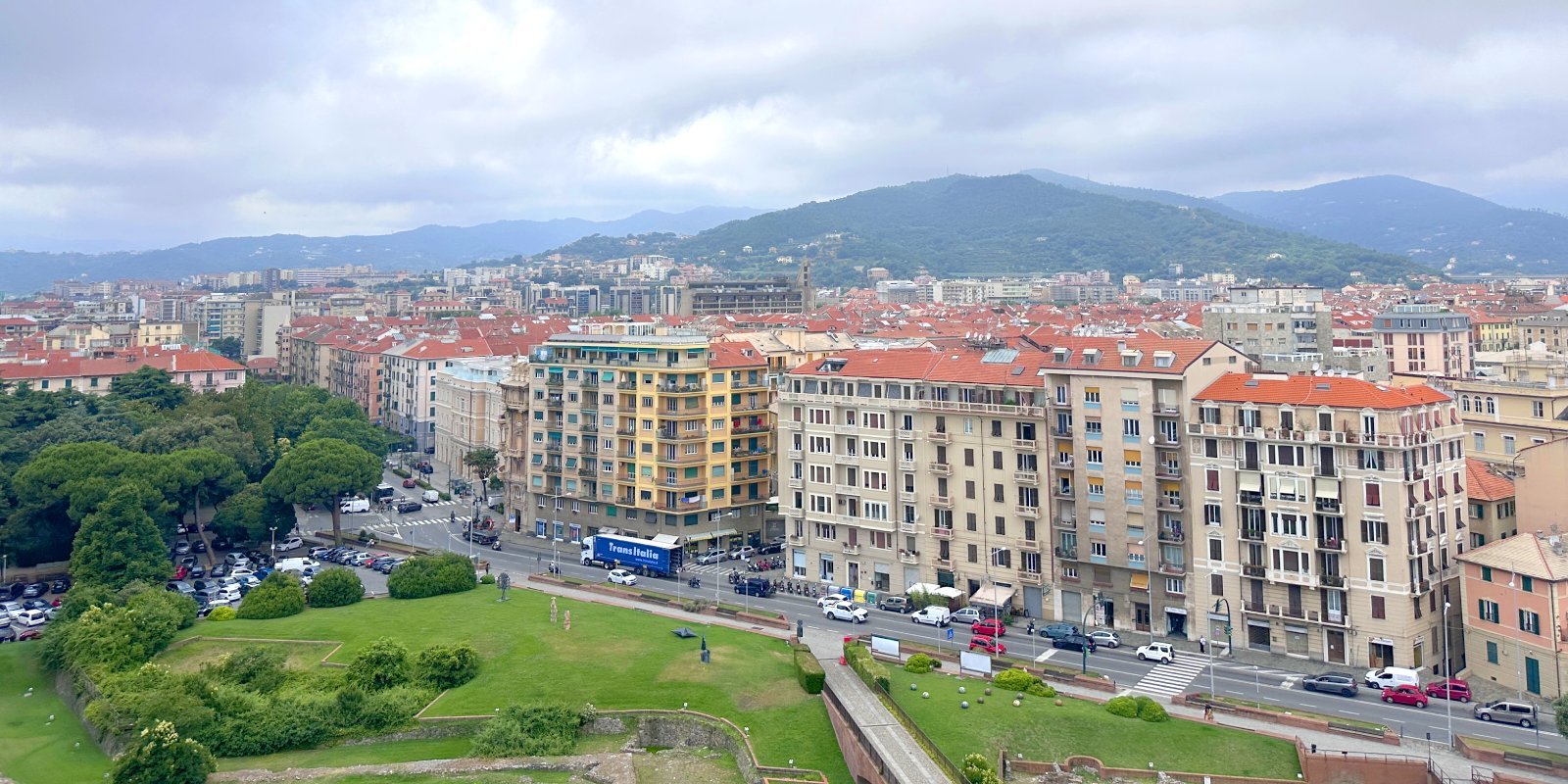 Savona in northern Italy with mountains and waterfront buildings