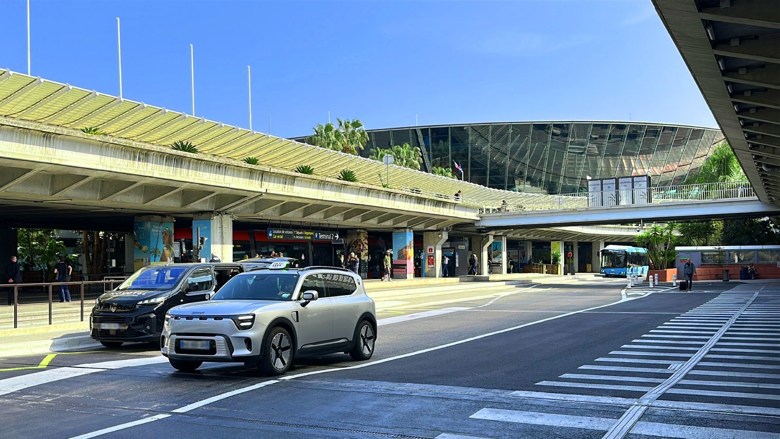 Official taxi vehicle departs from Nice Airport Terminal 1