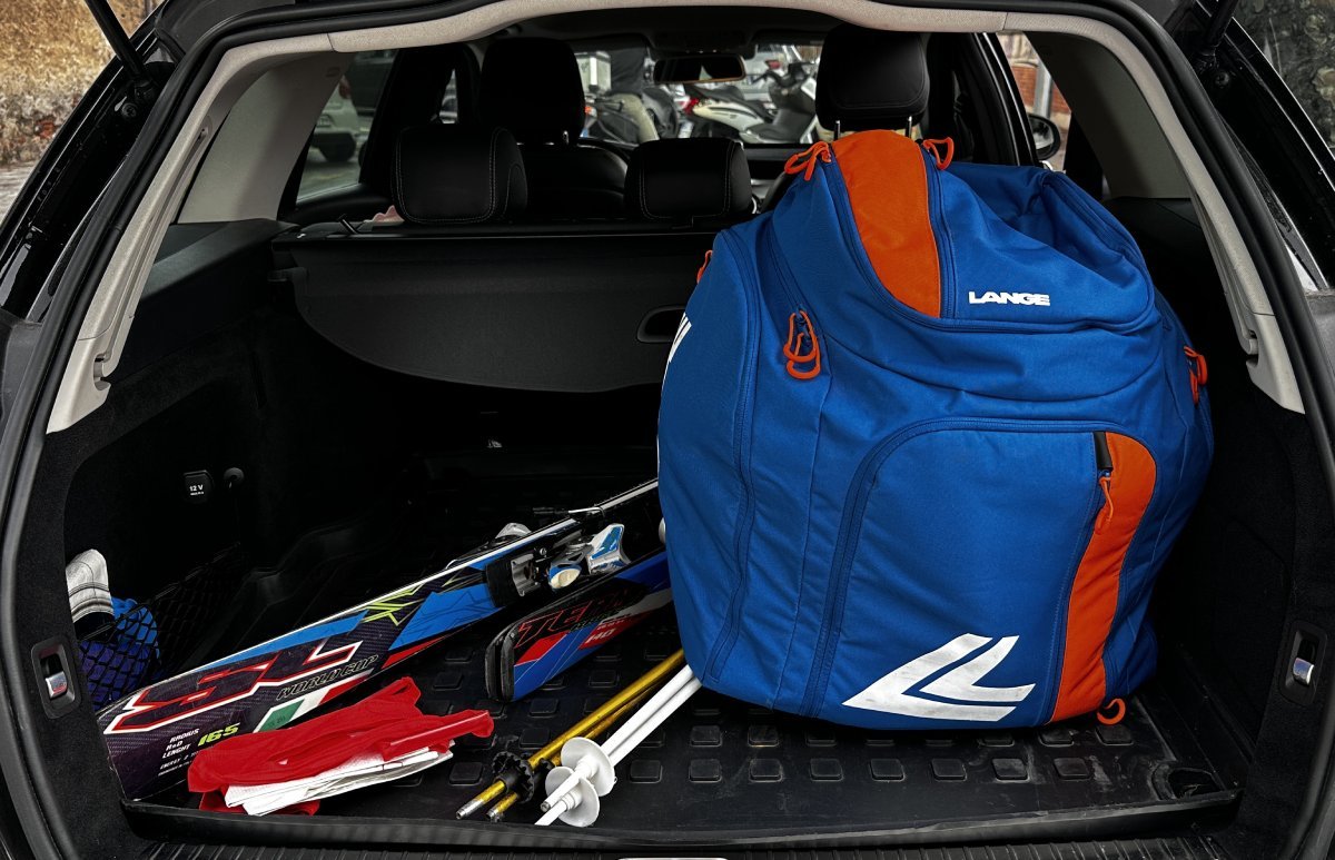 Ski boots bag and skis placed in the trunk for a Geneva to Courchevel transfer