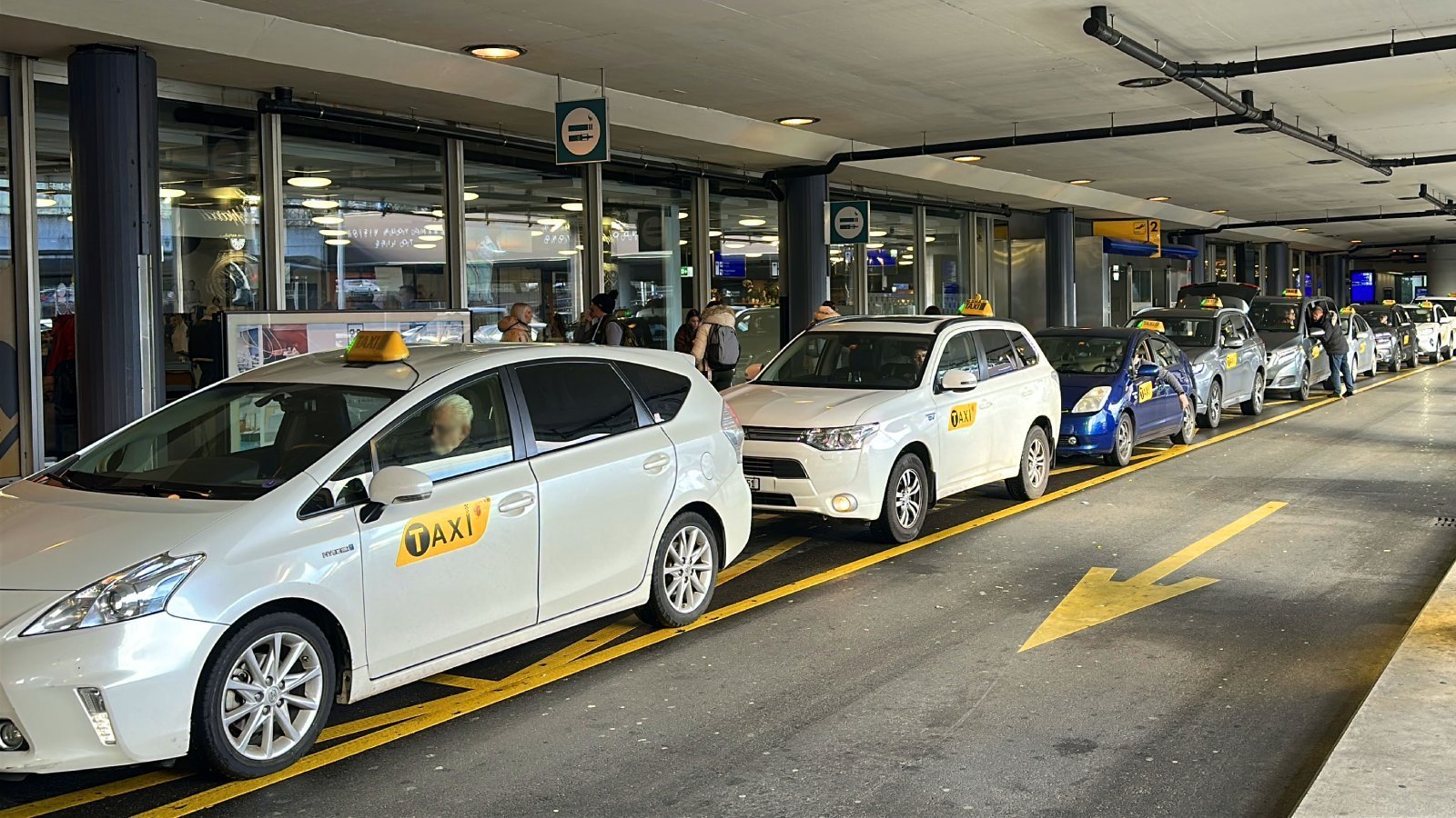Official taxi line at Geneva Airport with licensed taxis available for transfers to Courchevel