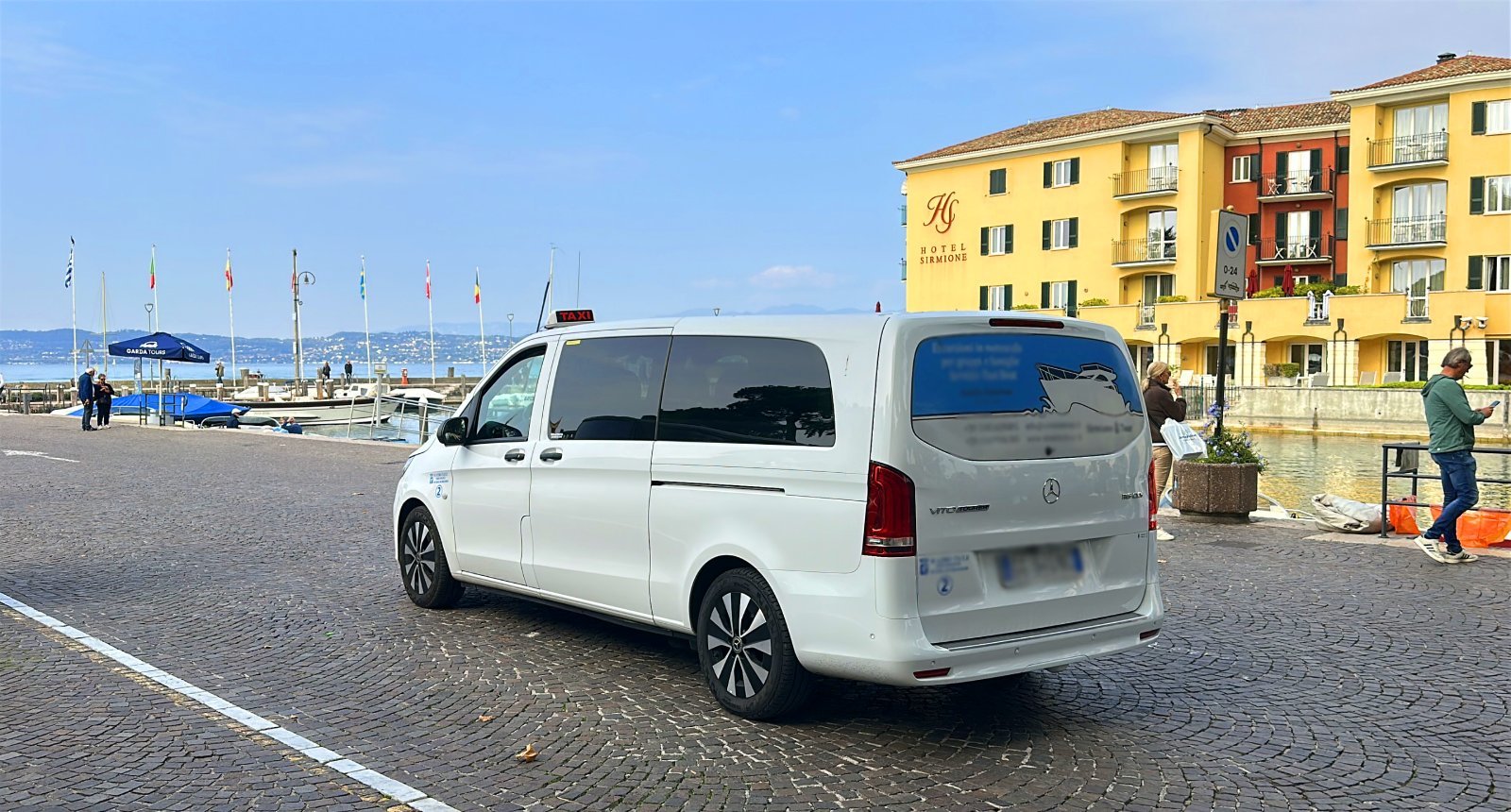 Official taxi car arrive from Milan to Sirmione port