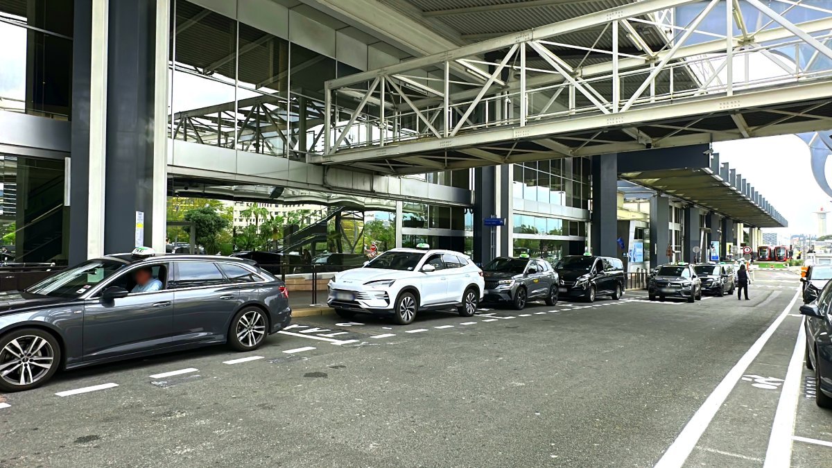 Official taxis waiting for passengers at Nice Airport for transfers to Port Grimaud