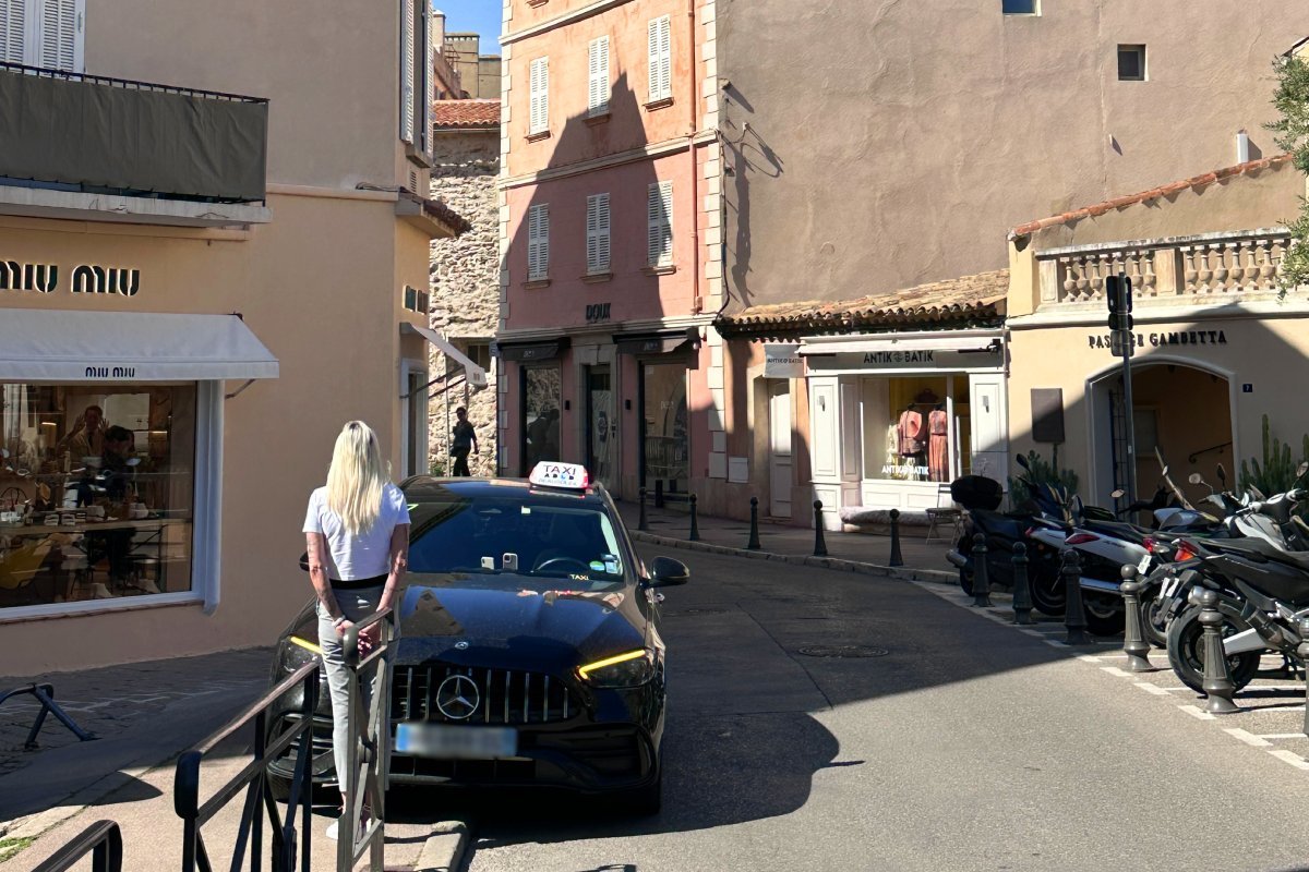 A taxi waits for passengers on the street in Saint-Tropez