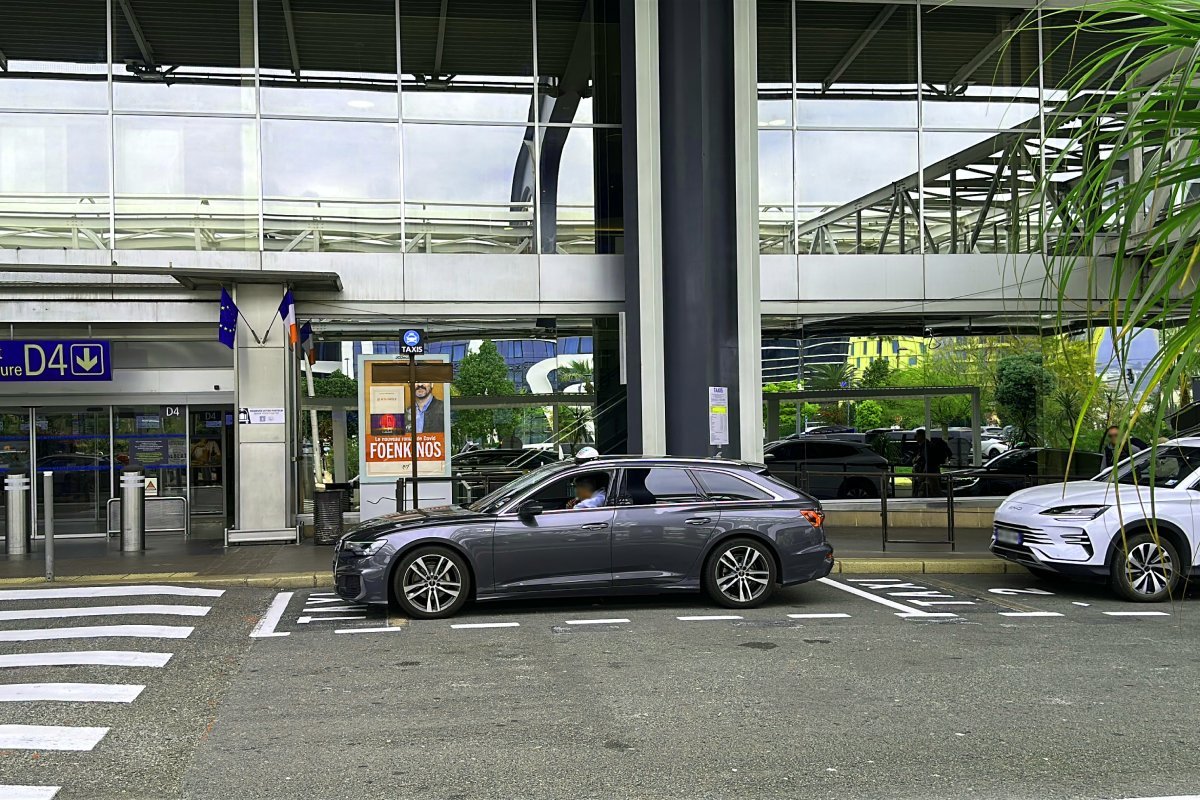 A taxi waits for passengers at the taxi rank at Nice Airport Terminal 2