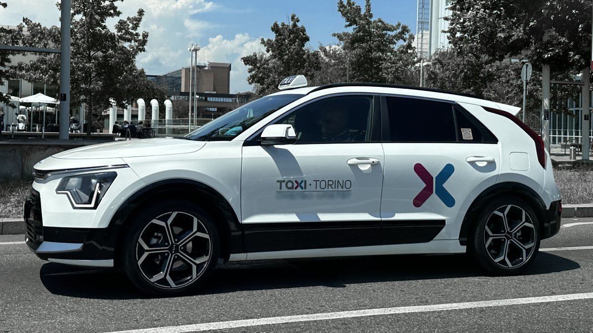 Official taxi waits for passengers to take them from Turin Airport to Champoluc