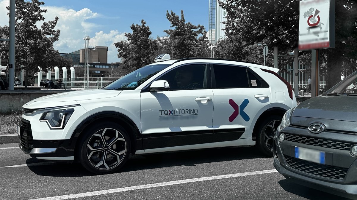 Official taxi waits for passengers to take them from Turin Airport to Sestriere