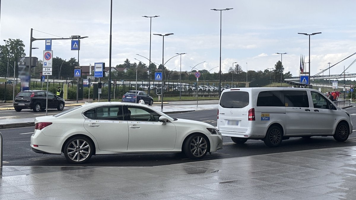 Official taxi waits for passengers to take them from Linate Airport to Cervinia