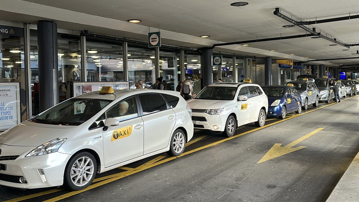 Official taxi is waiting for passengers to take them from Geneva airport to Chamonix