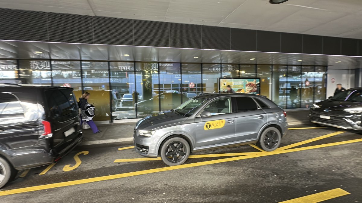 Official taxi is waiting for passengers to take them from Geneva airport to Val-d’Isere