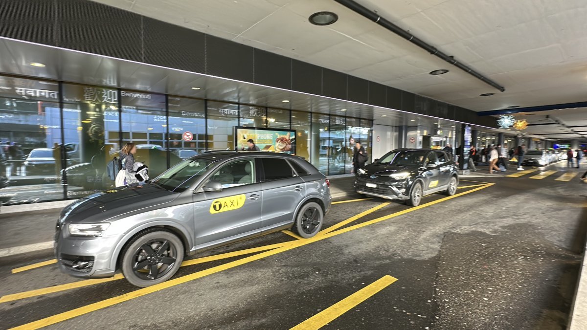 Official taxi is waiting for passengers to take them from Geneva airport to Val-Thorens