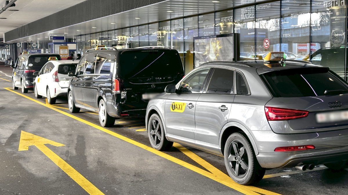 Official taxis waiting for passengers to take them from Geneva airport to Verbier