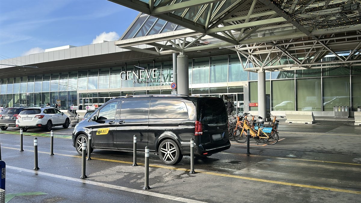 Official taxis waiting for passengers to take them from Geneva airport to Zermatt (Täsch)
