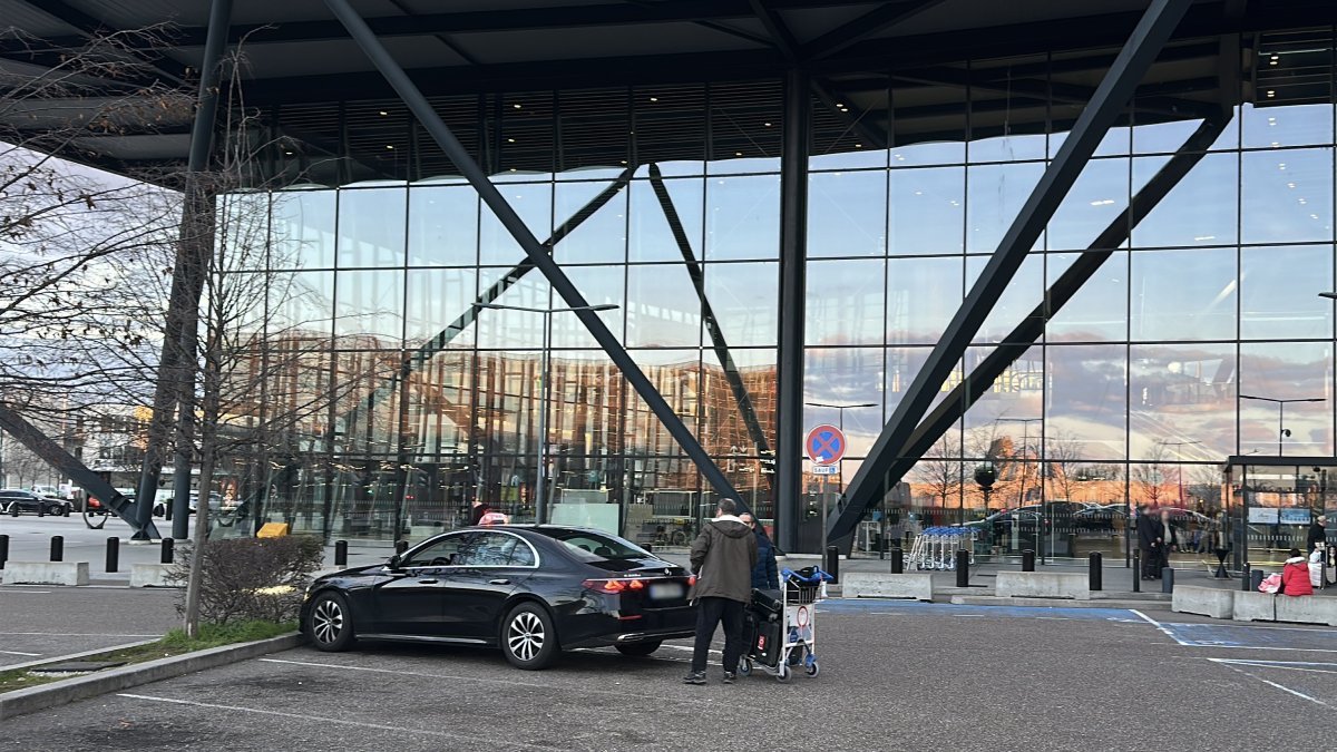 Official taxi waiting for passengers to take them from Lyon Airport to Chamonix