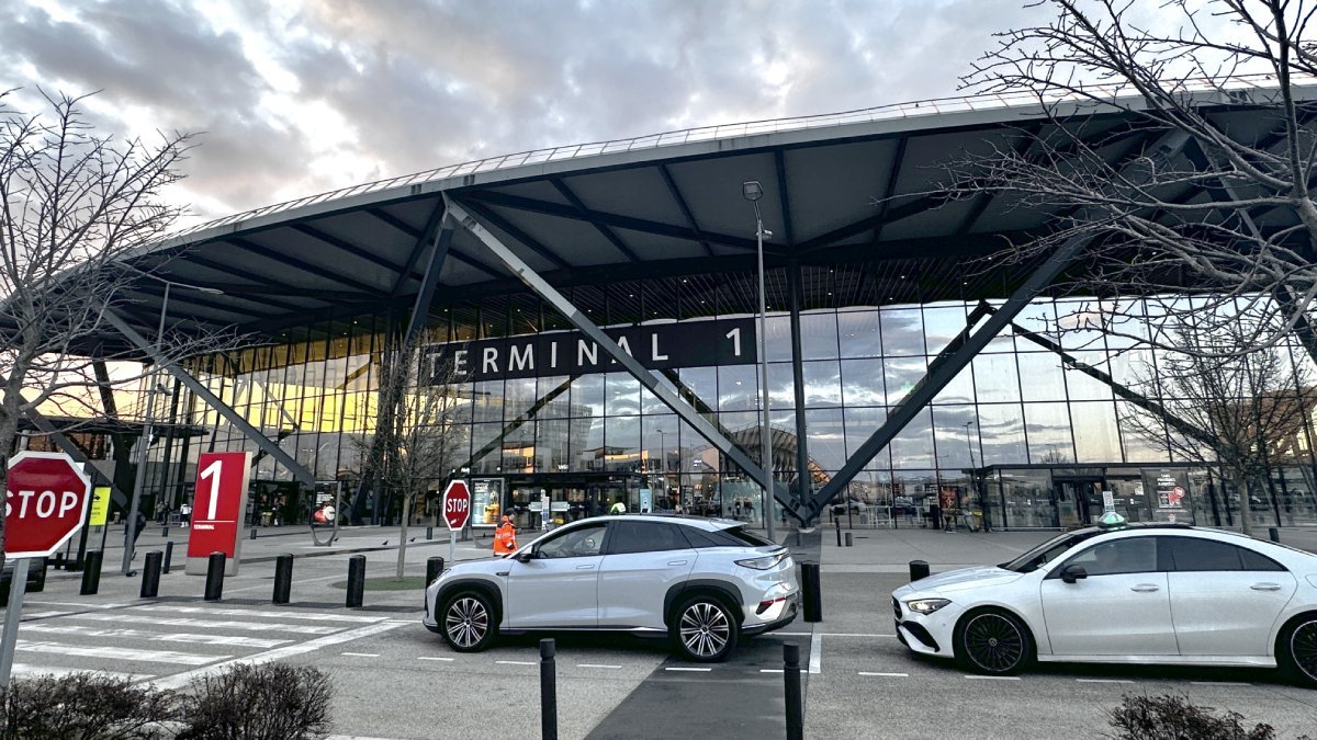 Official taxi waiting for passengers to take them from Lyon Airport to Morzine