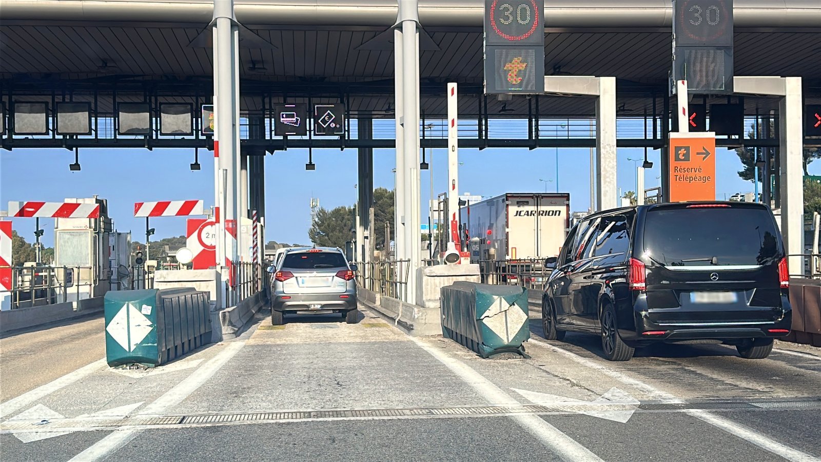 Cars at a toll booth on the A8 motorway on the way from Nice to Saint-Tropez