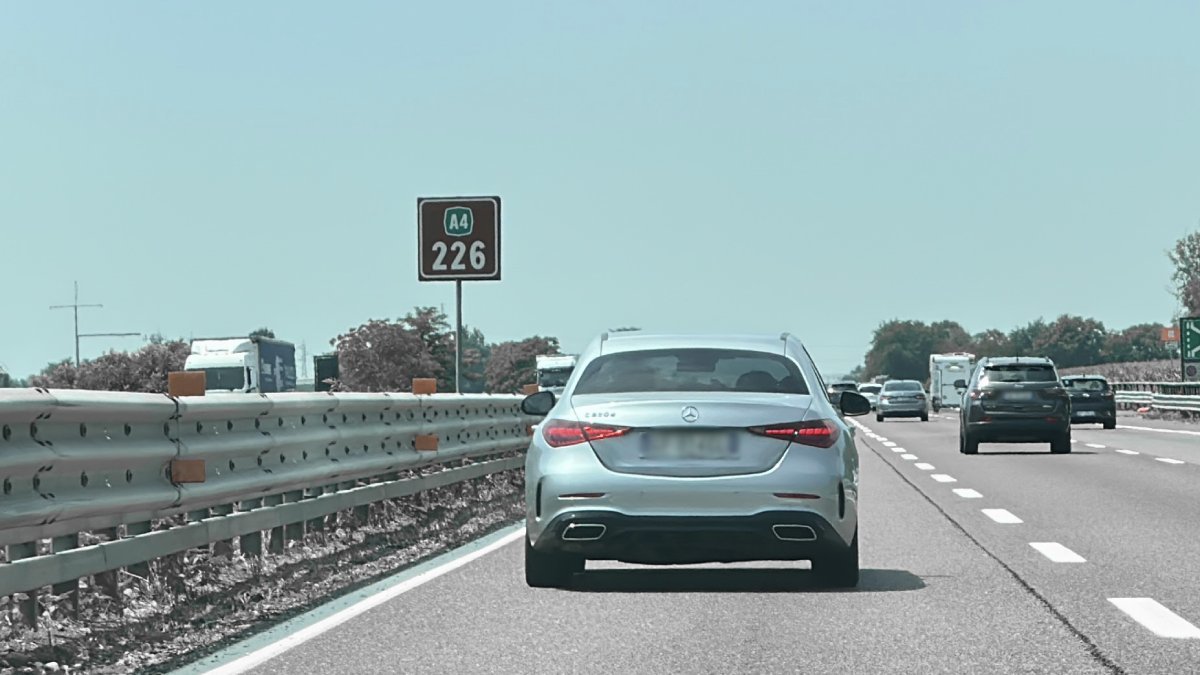 Car performs a transfer on the road from Bergamo Airport to Madonna di Campiglio