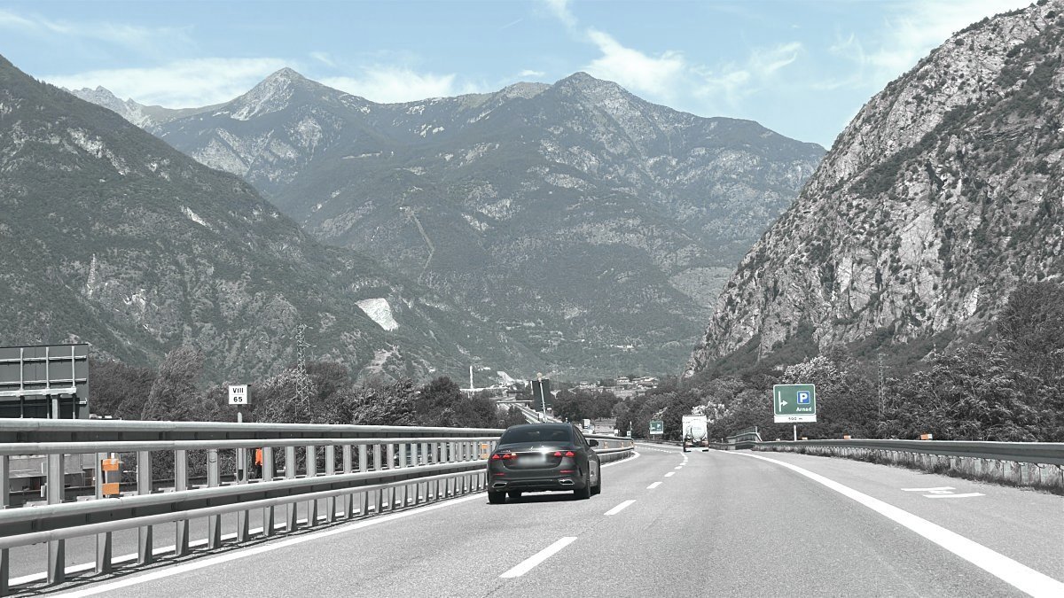 Car performs a transfer on the road from Linate Airport to Cervinia