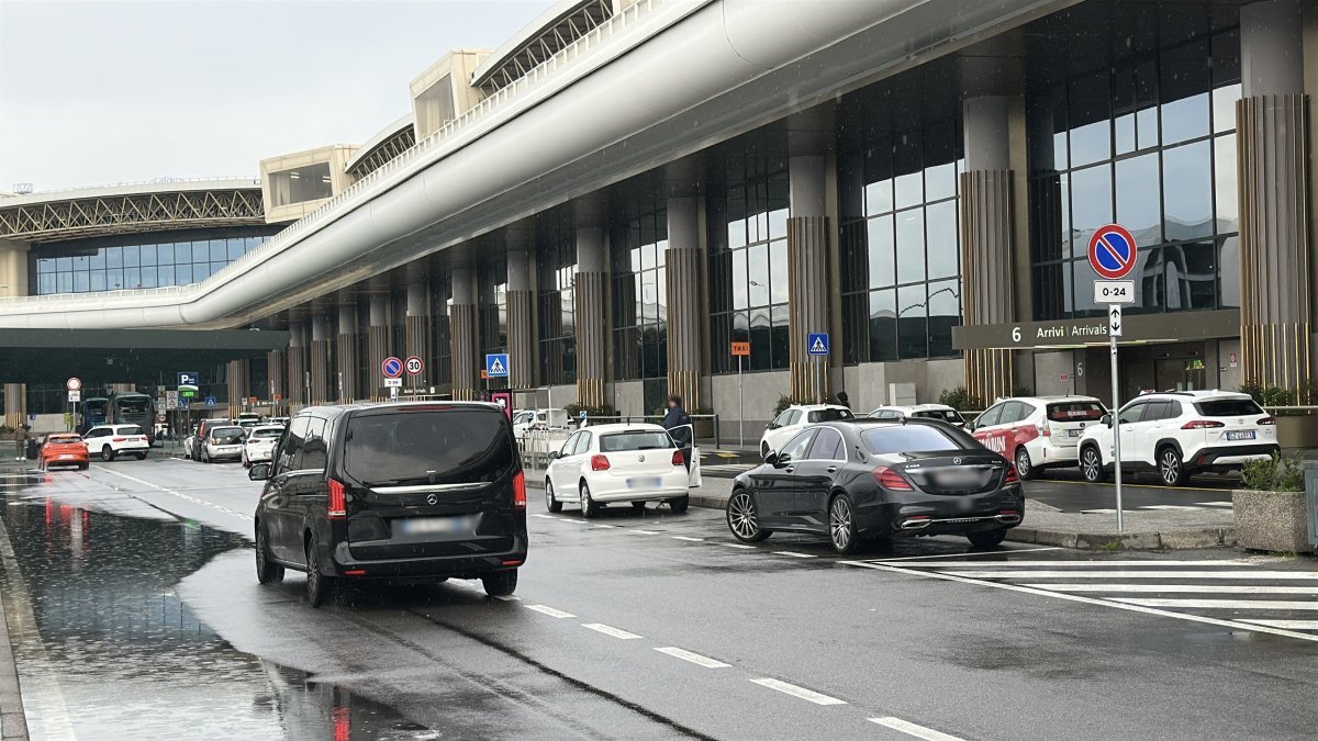 Car performs a transfer on the road from Malpensa Airport to Cervinia
