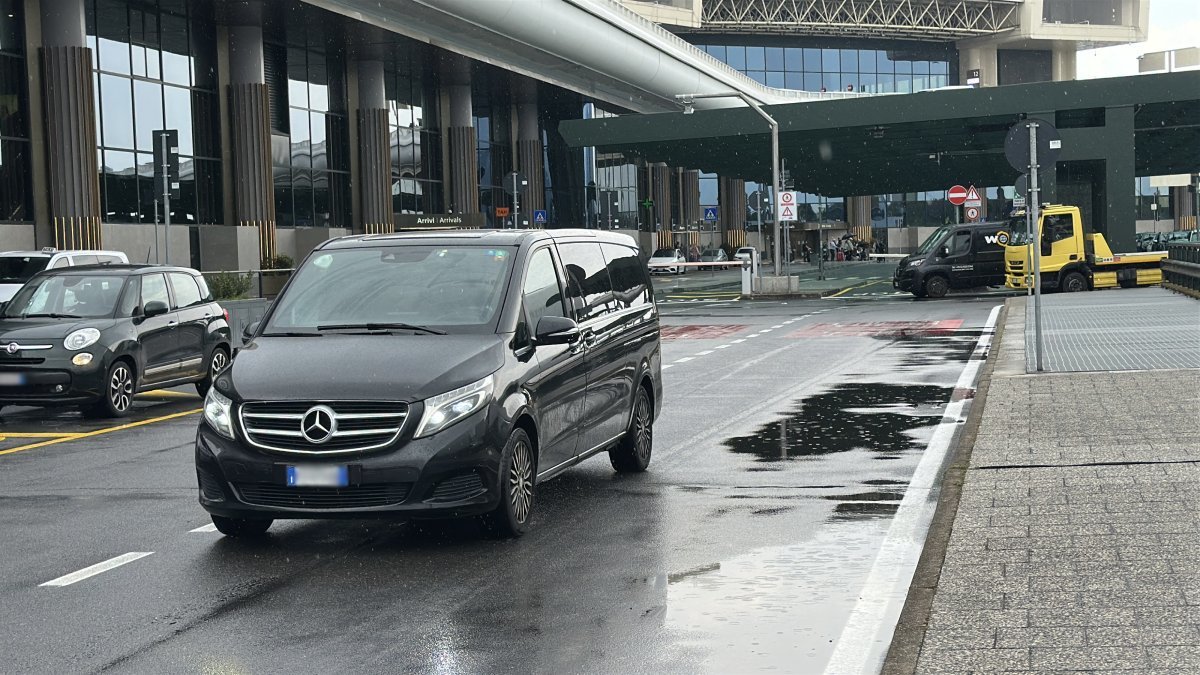 Car performs a transfer on the road from Malpensa Airport to St. Moritz
