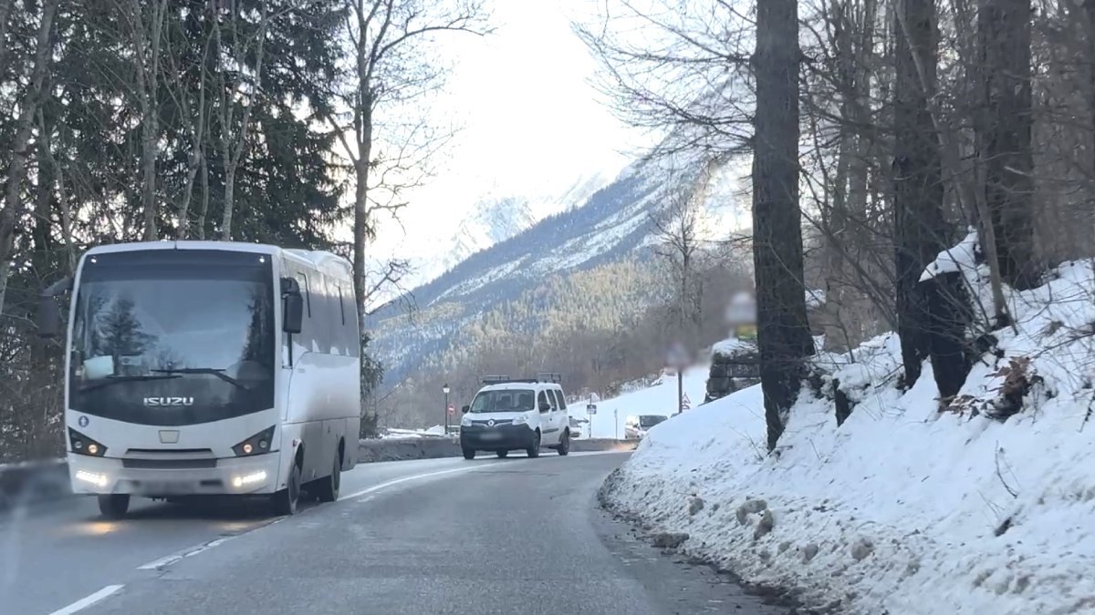 Bus takes passengers in winter along a mountain road from Geneva airport to Chamonix